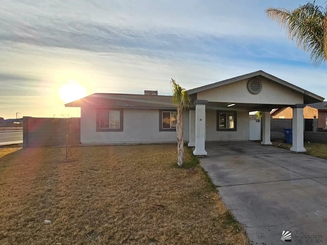 ranch-style house with a carport