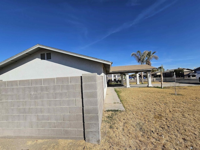 view of property exterior featuring a yard