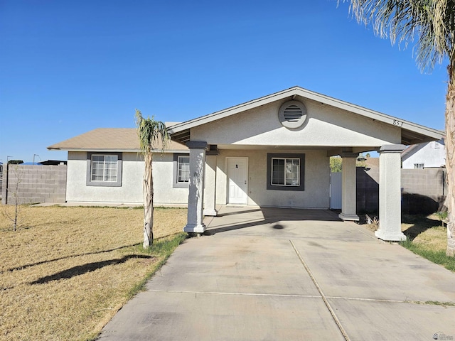 ranch-style home with a front lawn