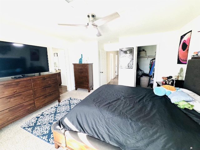 bedroom with ceiling fan and a closet