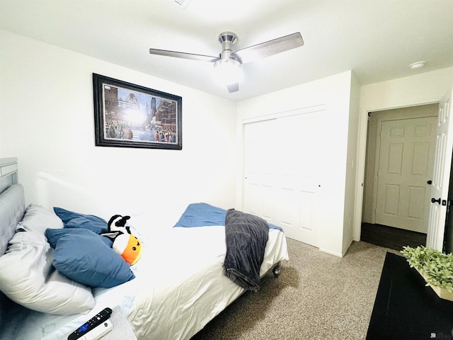 carpeted bedroom featuring ceiling fan and a closet