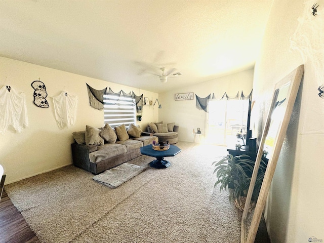 living room featuring carpet flooring and ceiling fan