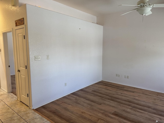 empty room with light wood-style flooring and ceiling fan