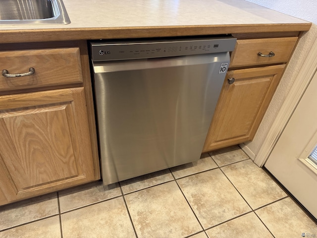 interior details with dishwasher and a sink