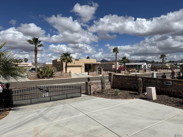 view of patio with fence and a gate