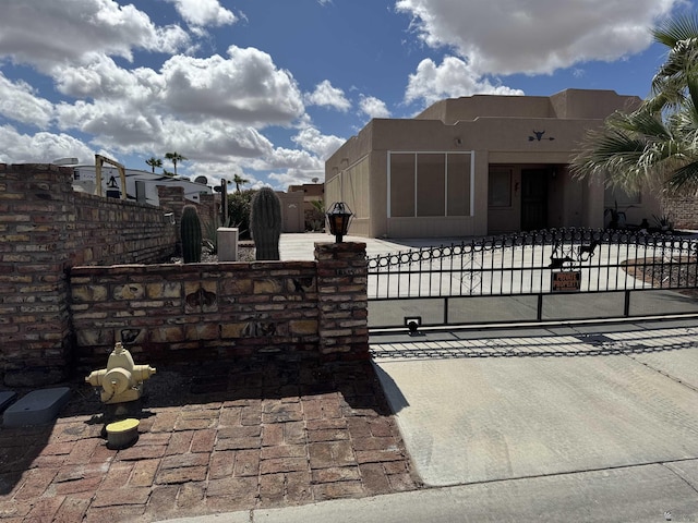 view of gate featuring fence