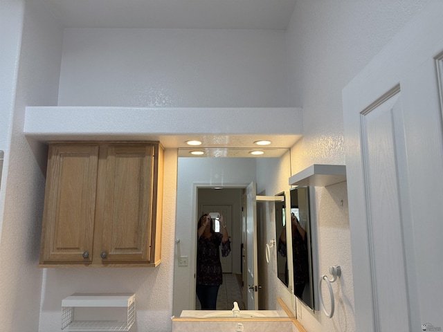 bathroom with a textured wall