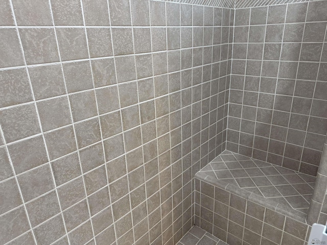 full bath with a tile shower