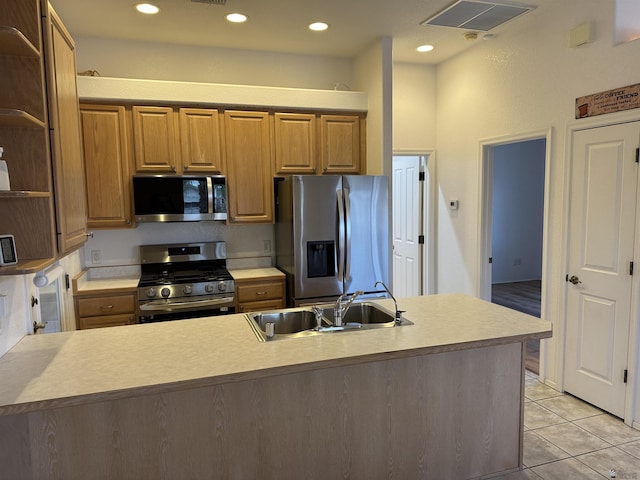 kitchen featuring visible vents, open shelves, a sink, appliances with stainless steel finishes, and light tile patterned floors