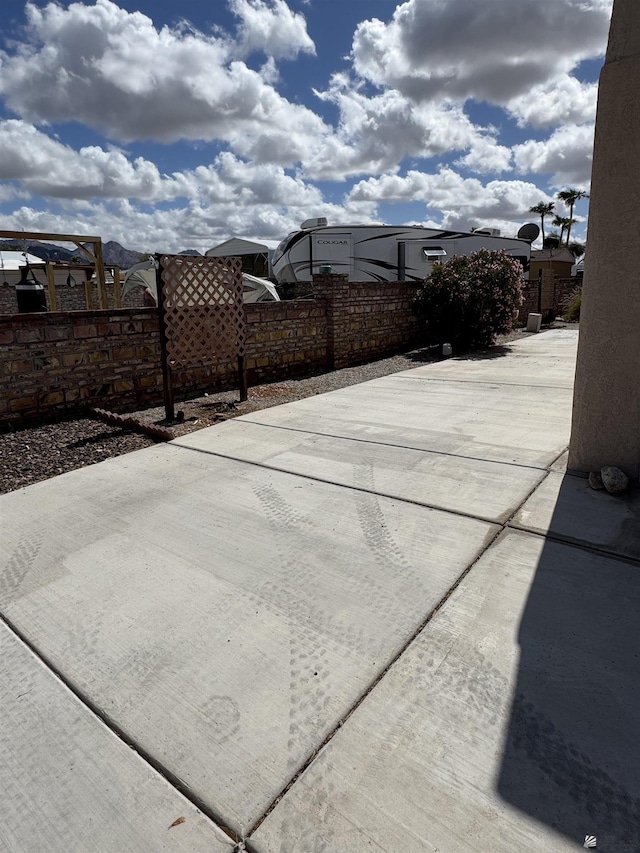 view of patio featuring fence