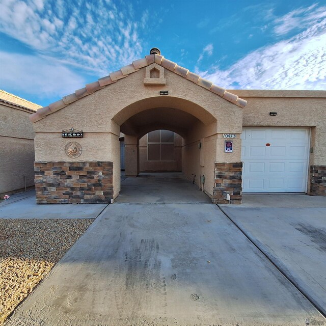 view of exterior entry featuring a garage