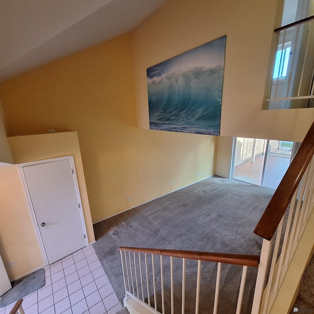 interior space with tile patterned flooring and stairs