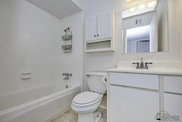 full bathroom featuring vanity, tiled shower / bath, tile patterned floors, and toilet