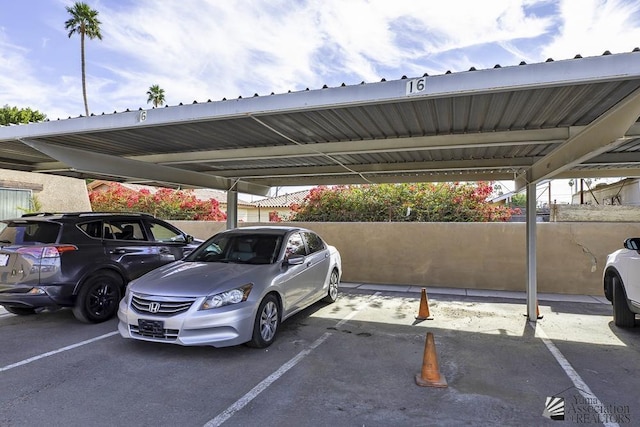 view of vehicle parking with a carport