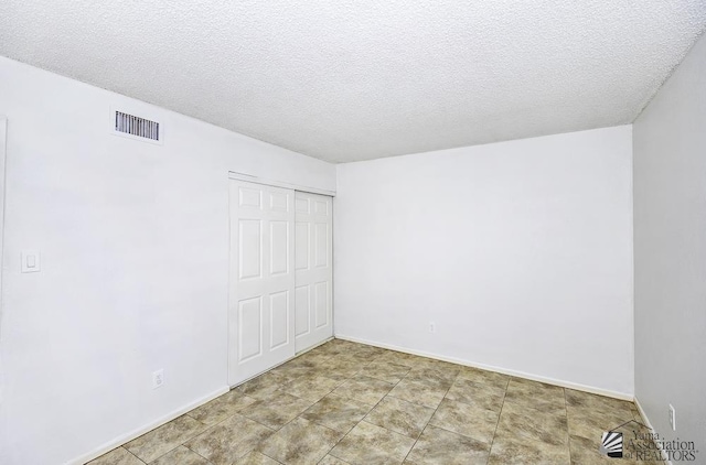 interior space with a textured ceiling