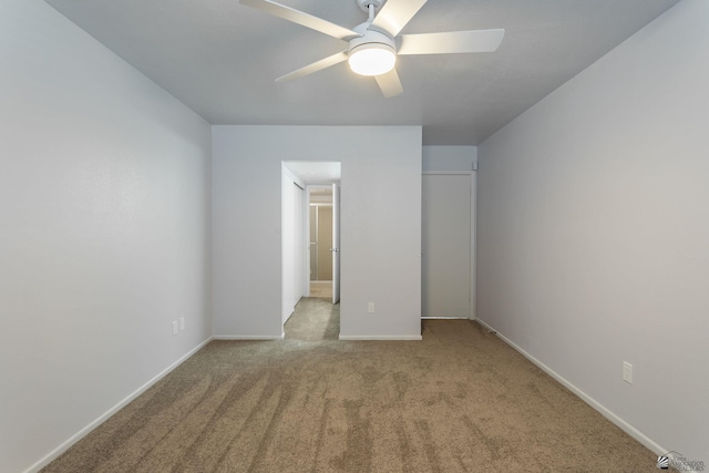 unfurnished bedroom featuring ceiling fan and light carpet