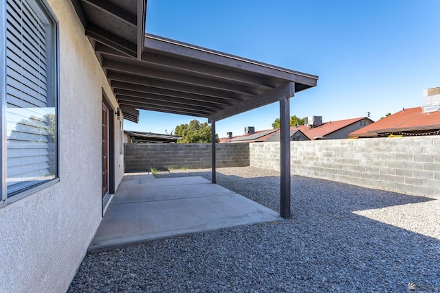 view of yard featuring a patio area and central AC