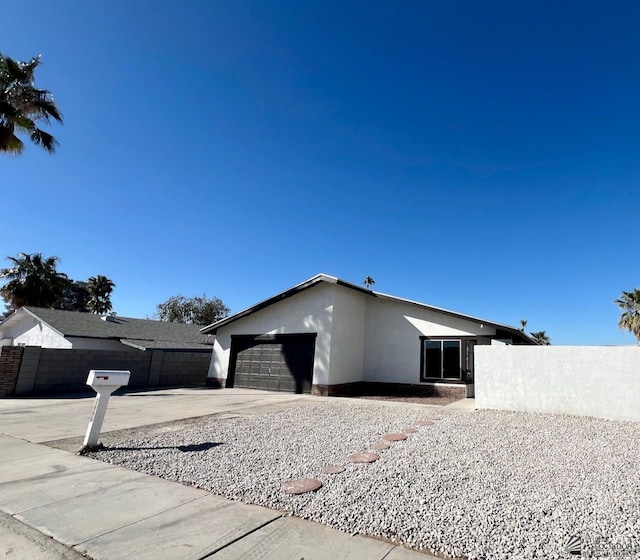 view of side of home with a garage