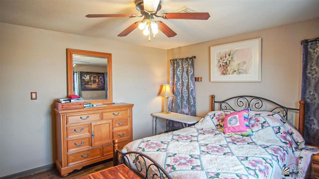 bedroom featuring ceiling fan and dark wood-type flooring