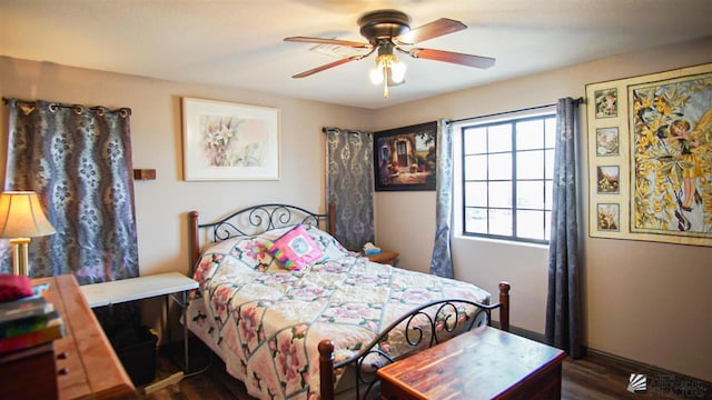 bedroom featuring ceiling fan and dark hardwood / wood-style flooring