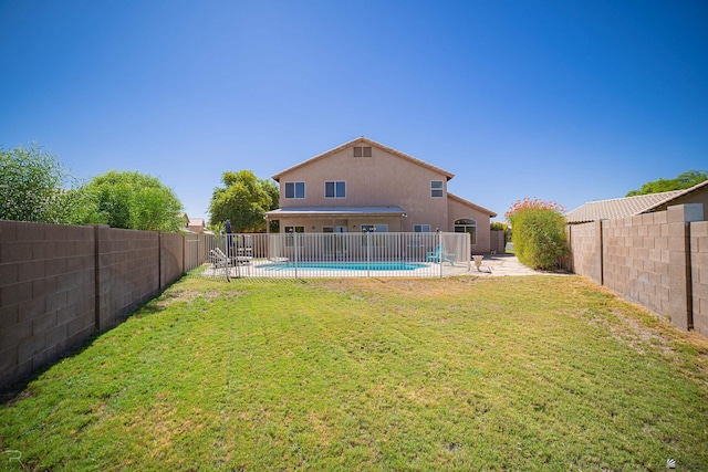 view of yard with a patio area and a fenced in pool