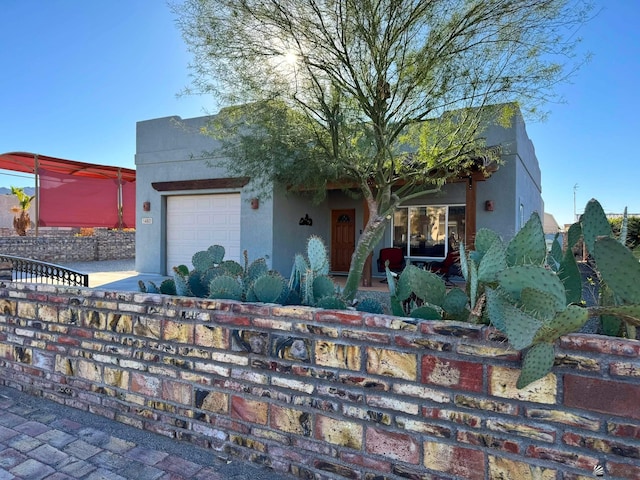 view of front of property with a garage