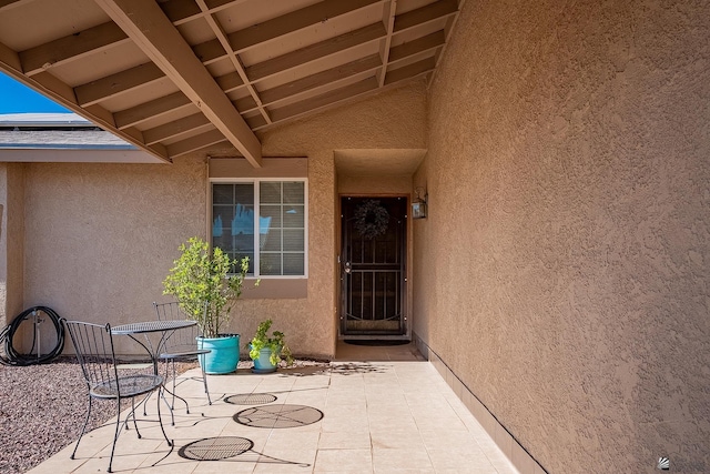 property entrance with a patio area