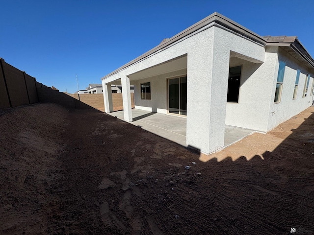 view of property exterior featuring a patio area