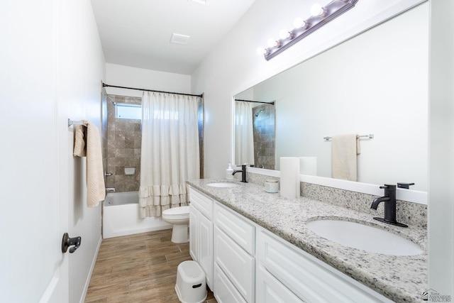 full bathroom featuring vanity, toilet, and shower / bath combo