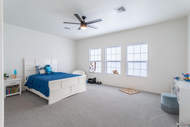 carpeted bedroom with ceiling fan