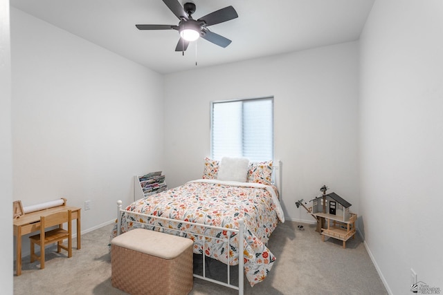 bedroom with ceiling fan and light colored carpet