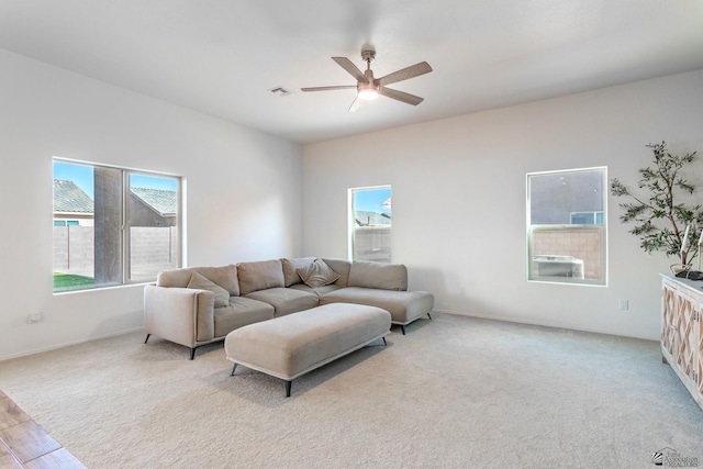 living room with light hardwood / wood-style flooring and ceiling fan