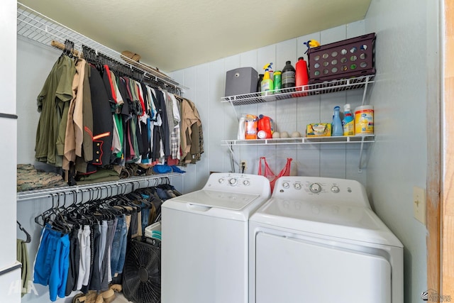 laundry room with washing machine and clothes dryer