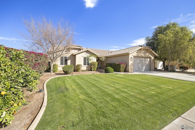 view of front facade featuring a garage, a front yard, driveway, and stucco siding