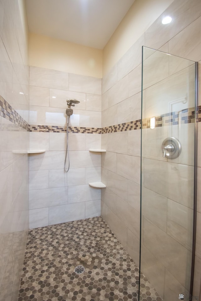 bathroom with tiled shower