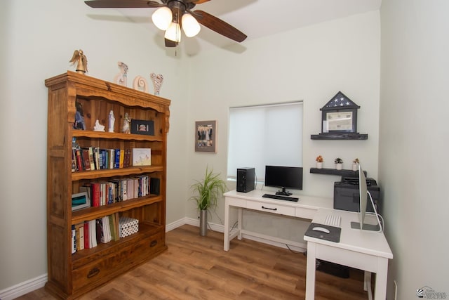 home office featuring hardwood / wood-style floors and ceiling fan