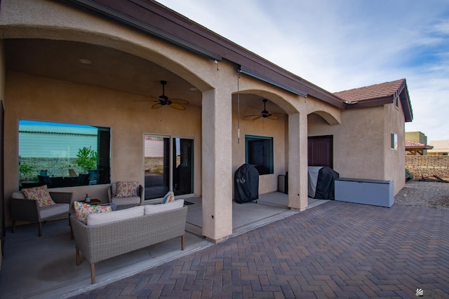 view of patio / terrace with grilling area, ceiling fan, and outdoor lounge area