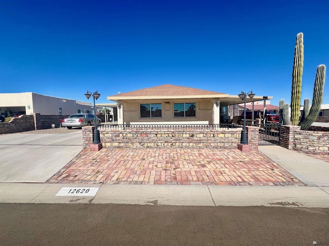 view of front of home with a carport