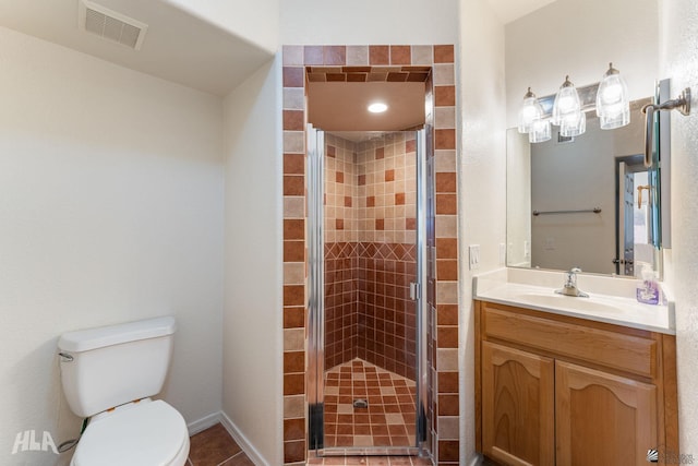 bathroom with toilet, tile patterned floors, walk in shower, and vanity