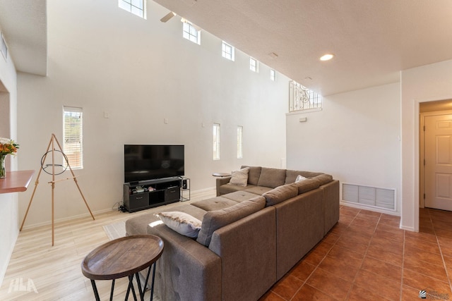 living room featuring a high ceiling