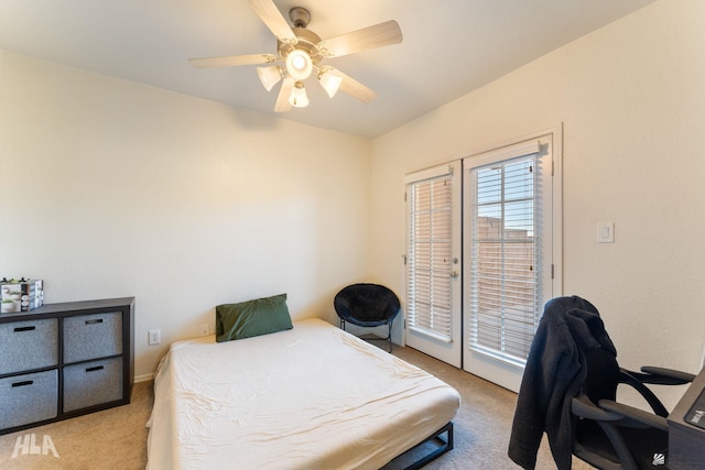 bedroom featuring access to outside, light colored carpet, french doors, and ceiling fan