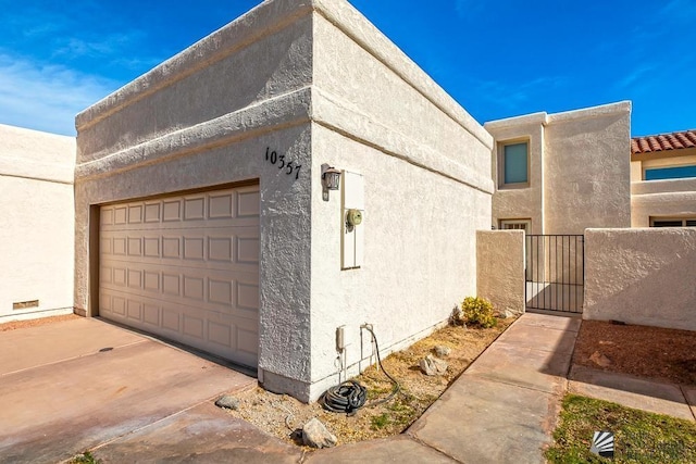 view of property exterior with a garage