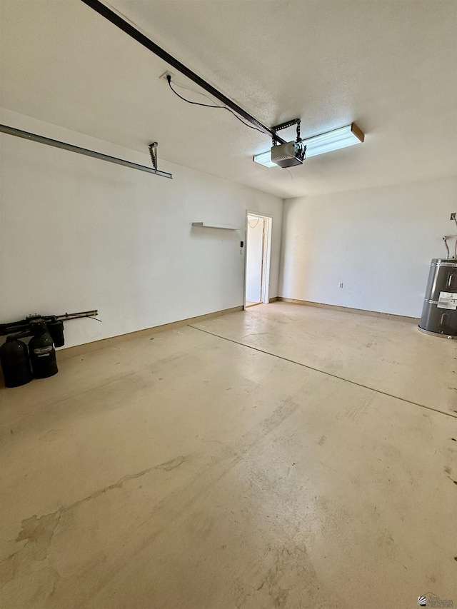 garage with a garage door opener and electric water heater