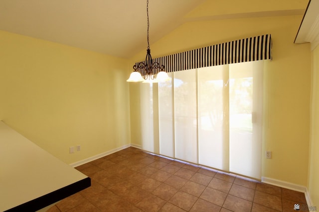 unfurnished dining area featuring lofted ceiling, a chandelier, and tile patterned flooring