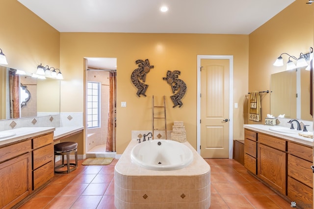 bathroom with vanity, tile patterned floors, and separate shower and tub