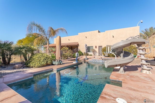 view of pool featuring a water slide