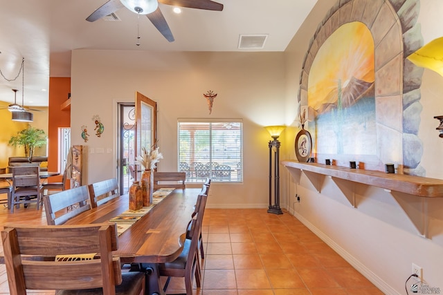 tiled dining room with ceiling fan