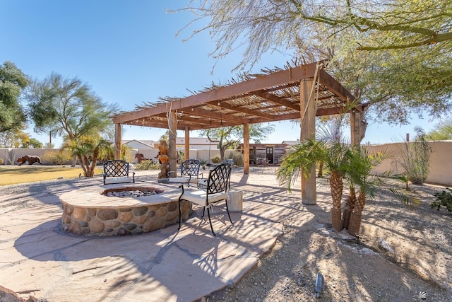 view of patio with a fire pit