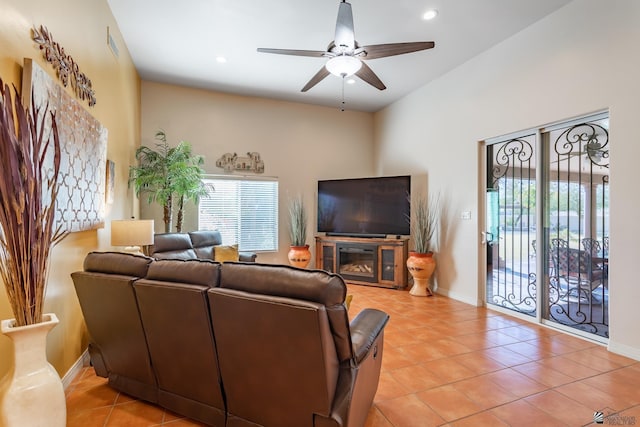 living room featuring light tile patterned floors and ceiling fan