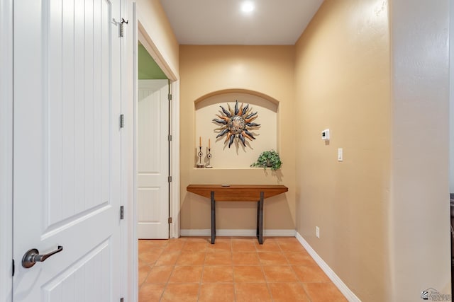 hallway featuring light tile patterned floors